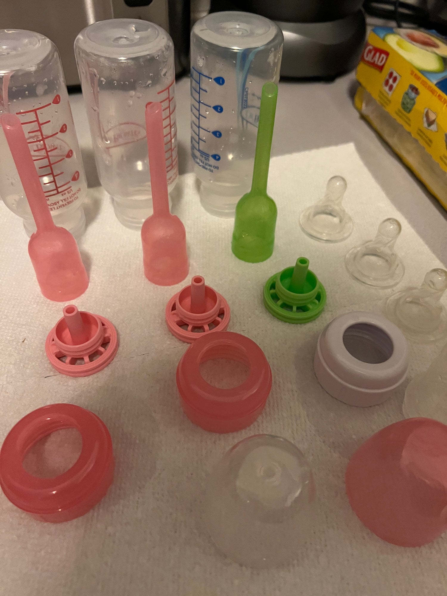 Postpartum support cleaning baby bottles and pump parts